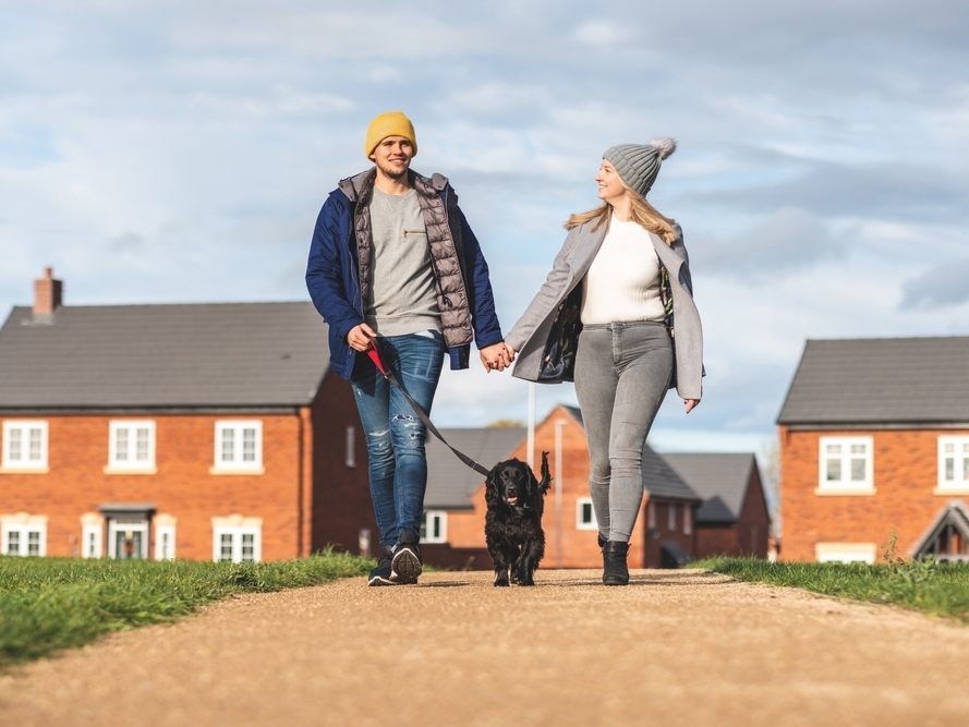 couple walking dog