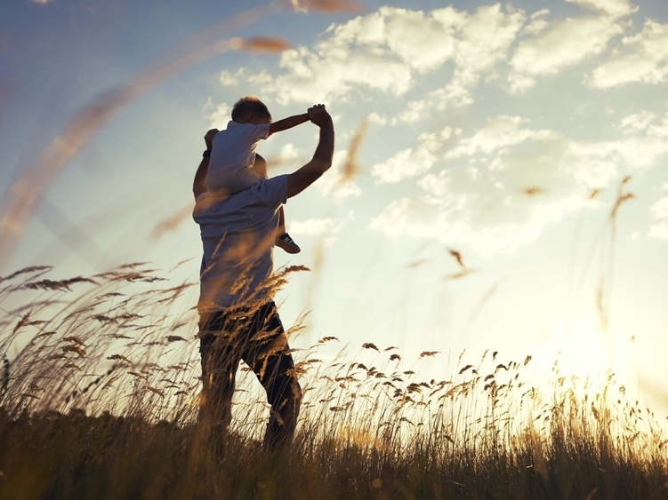 father and son on shoulders