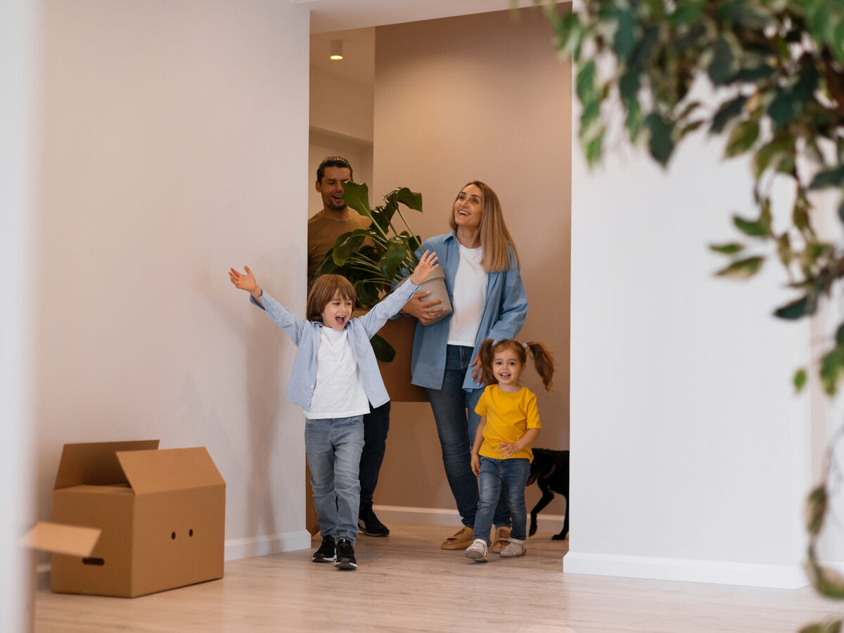 Happy family with dog moving new home