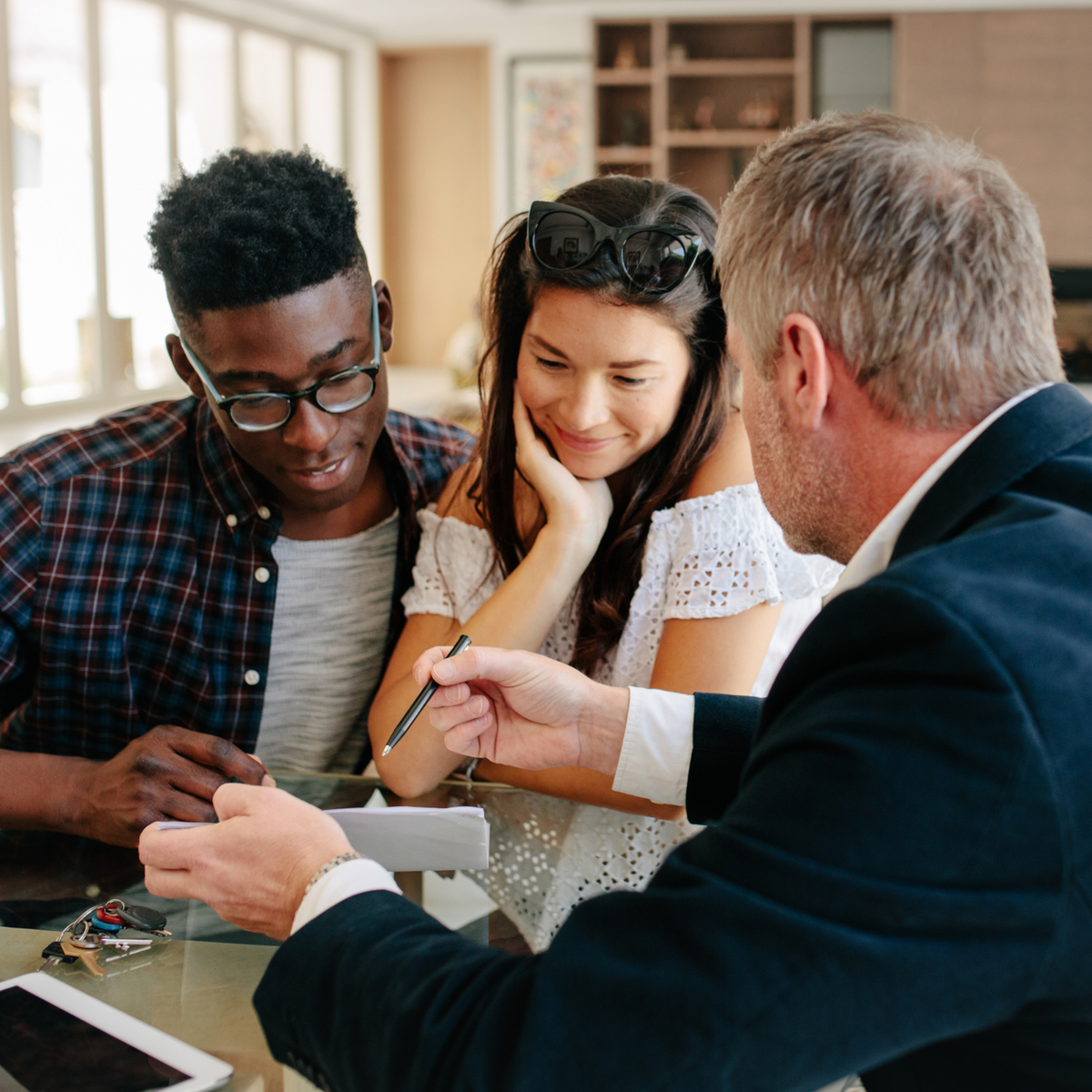 couple speaking to man